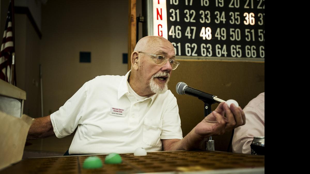 
David McCanna, 84, of Atwater calls out bingo numbers at the Merced Senior Community Center on Friday. McCanna stays active to combat the depression and isolation he experienced after his wife’s death. 
