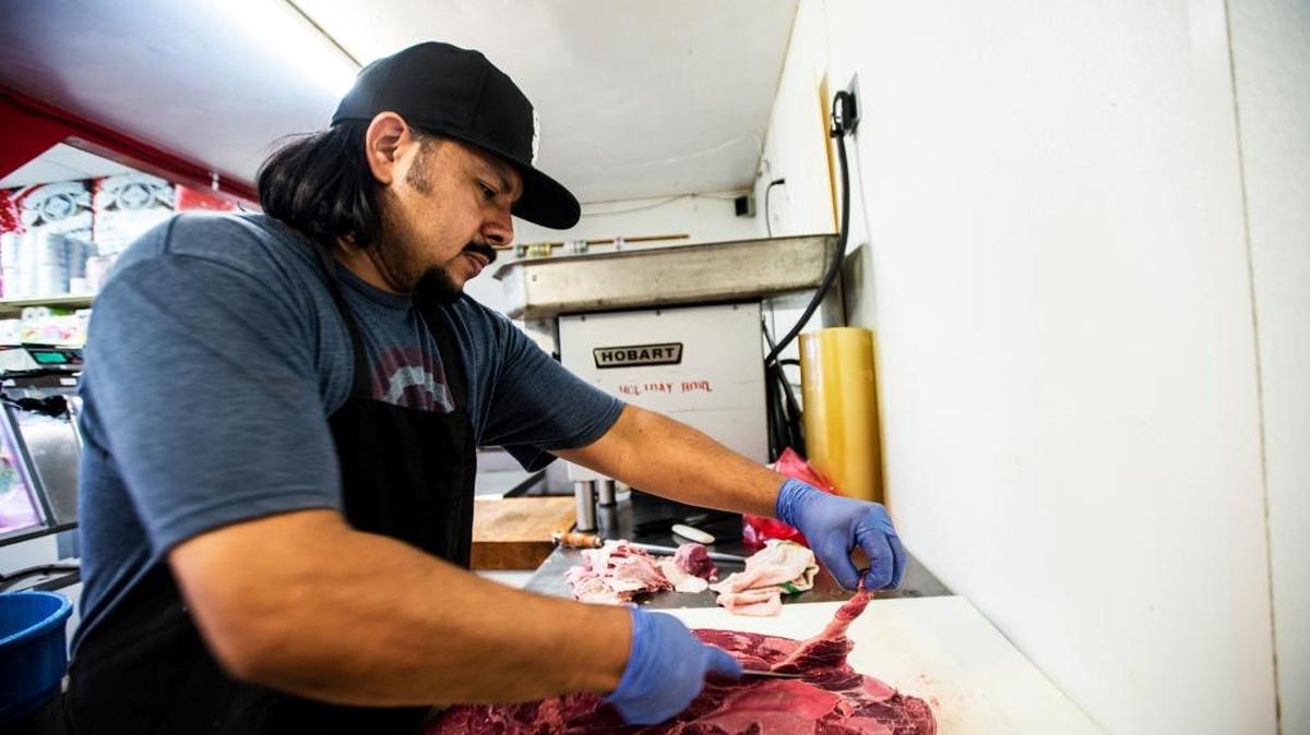 Luis Morales, 40, of Livingston trims cuts of beef Tuesday at his Carniceria Rio Grande Meat Market at 1220 West Ninth St. in Merced. Morales says he has his doubts about the presumed risks of consuming red meat.