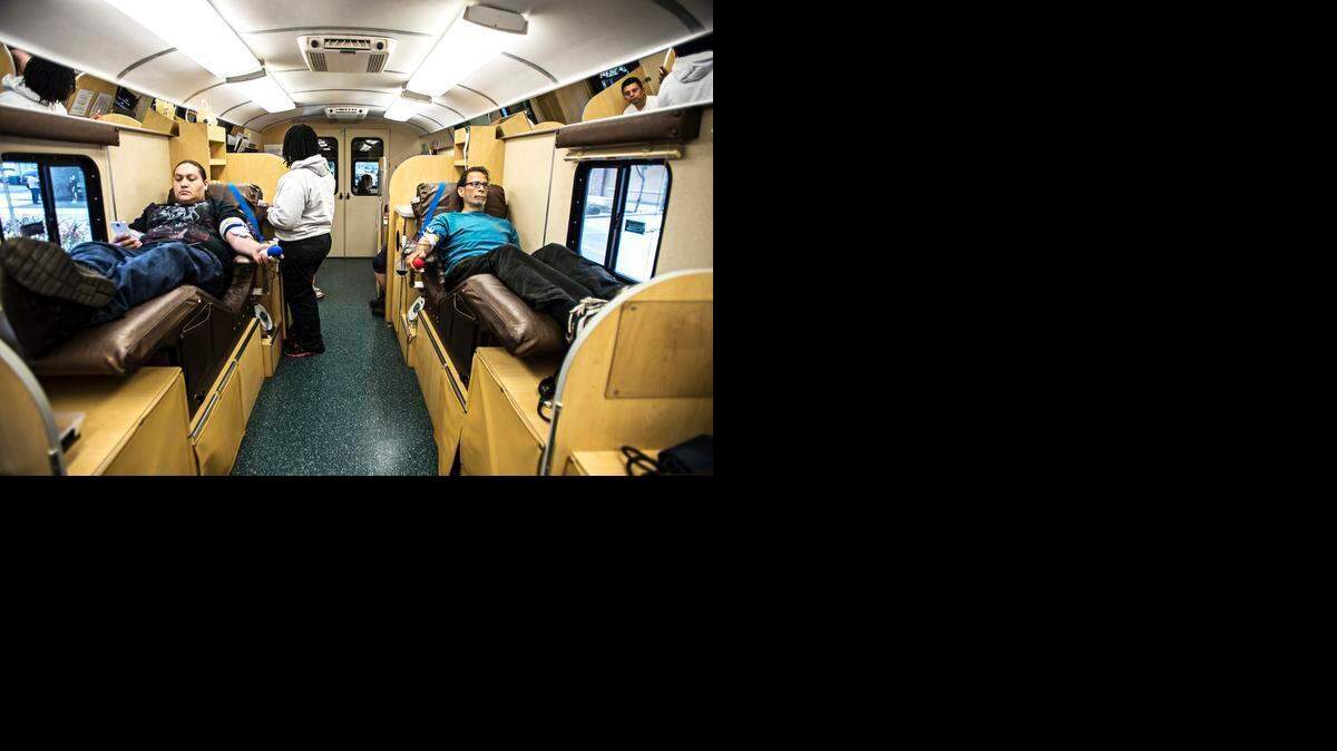 
Merced residents Michelle Barrios, 28, left, and Thomas Guillory, 57, donate blood inside the BloodSource mobile bank in downtown Merced on Tuesday. There is a constant need of platelets, which have a five-day shelf life.
