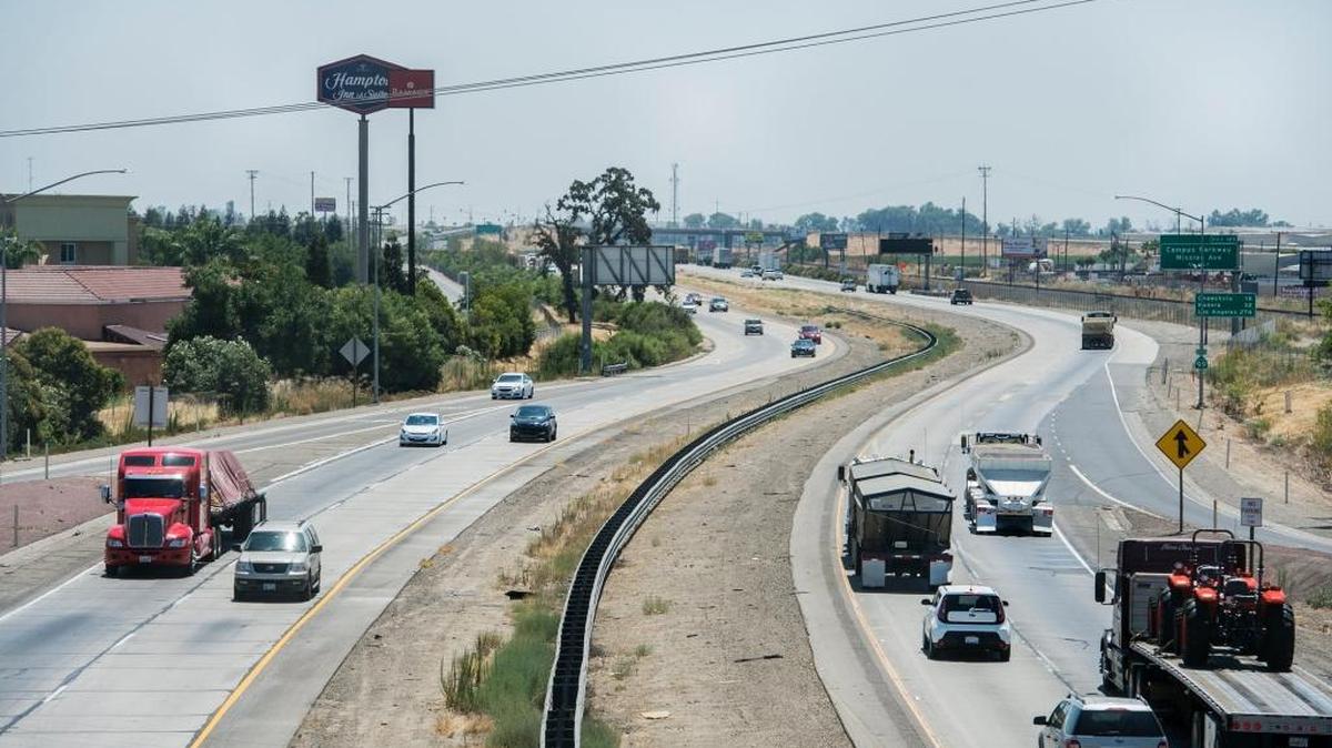 Motorists drive along Highway 99 as seen from East Childs Avenue in Merced, Calif., Tuesday, July 26, 2016. According to the San Joaquin Valley Air Pollution Control District, May to September is when levels of ozone pollution spike.