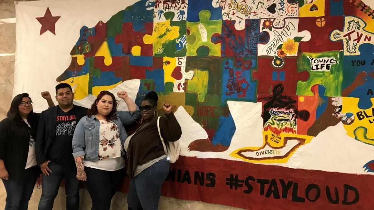People from a Merced youth group, We’Ced Youth Media, presented an art piece at the state capitol Tuesday June 6, 2017 that represents the issues community members face and the campaign that advocates for accessible and affordable healthcare for everyone regardless of immigration status, Health4All.