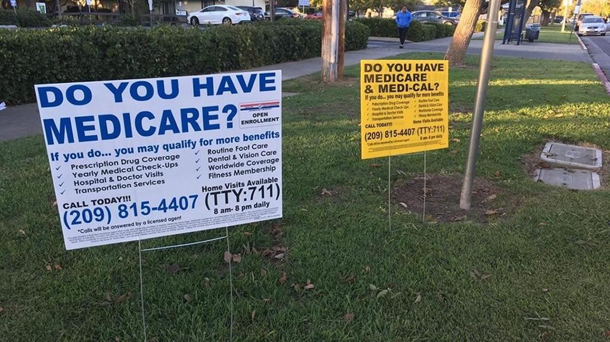 Signs in front of Golden Valley Health Center on E Childs Avenue in Merced with Medicare information on Nov. 1, 2016, the day open enrollment for Covered California started,