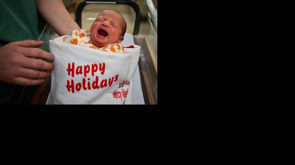 
Newborn Felix Alexander McCalley is held by registered nurse Katie Bernard, 37, of Merced before being released from the hospital with mother Rachael McCalley, 25, at Dignity Health Mercy Medical Center on Wednesday. McCalley was born Monday at 1 p.m. and weighed 7 pounds, 1 ounce.

