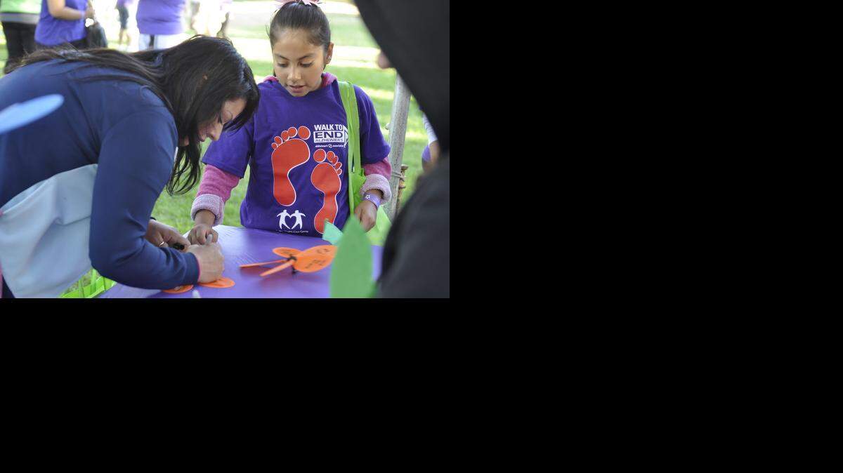 
During Saturday’s event, participants chose different colored pinwheels shaped like flowers and wrote special messages to loved ones who’ve been affected by or lost their lives to the disease. Participants then planted their pinwheels in the ground during the event, creating a tribute garden.
