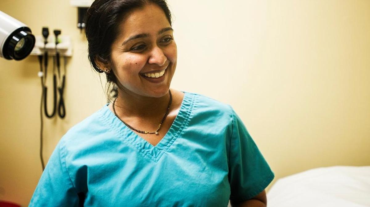 Dentist Remya Niranjan speaks about treating patients during the spring fair at Livingston Community Health in Livingston, Calif., Saturday, April 25, 2015. A new clinic will be coming to Delhi in early April that will offer dental, medical and behavioral services.