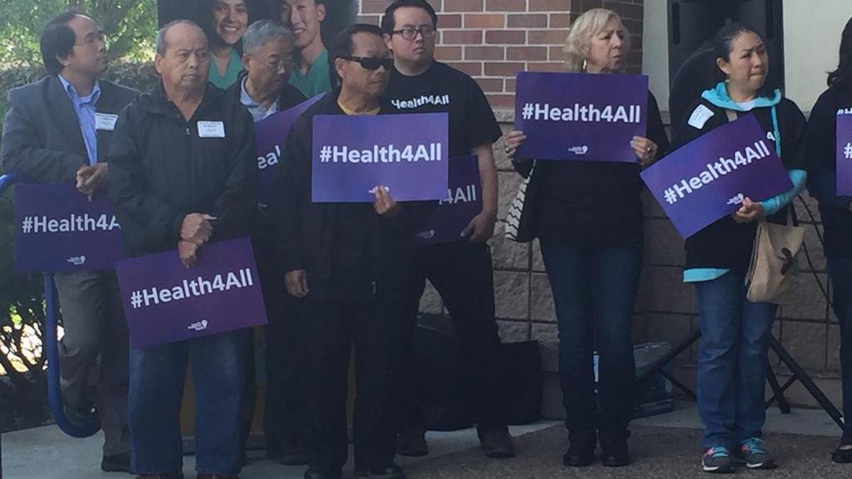 Merced residents gather April 28, 2016, for a rally in front of the Public Health Department to encourage health care services for everyone.