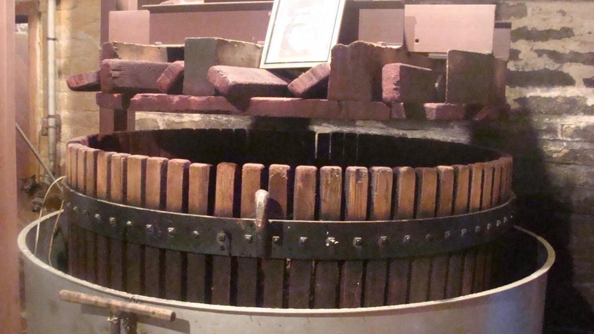 An early crusher at Ficklin Vineyards. It is still in use today at the vineyard.
