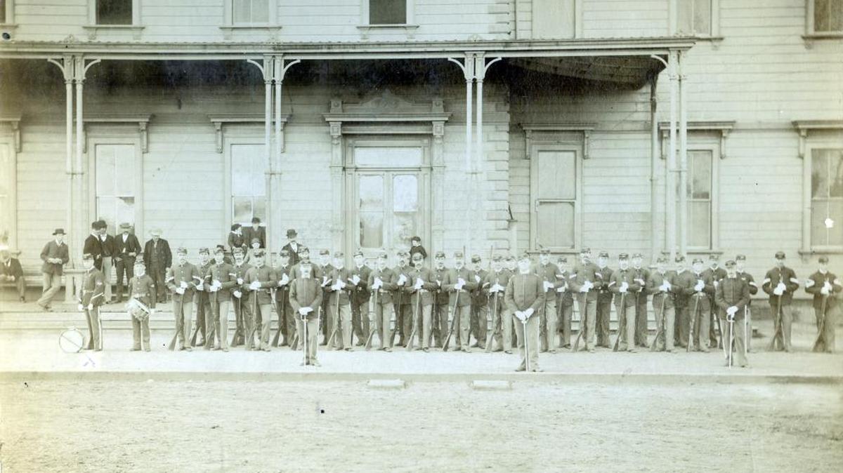 Company H, Sixth Infantry Regiment, National Guard of California (NGC) was organized in Merced in 1893 and disbanded in 1907. The troops with its three commanding officers are seen in front of El Capitan Hotel and Southern Pacific Passenger Depot, probably before their departure to Bakersfield to break the Railroad Strike in 1894. (Courthouse Museum Collection)
