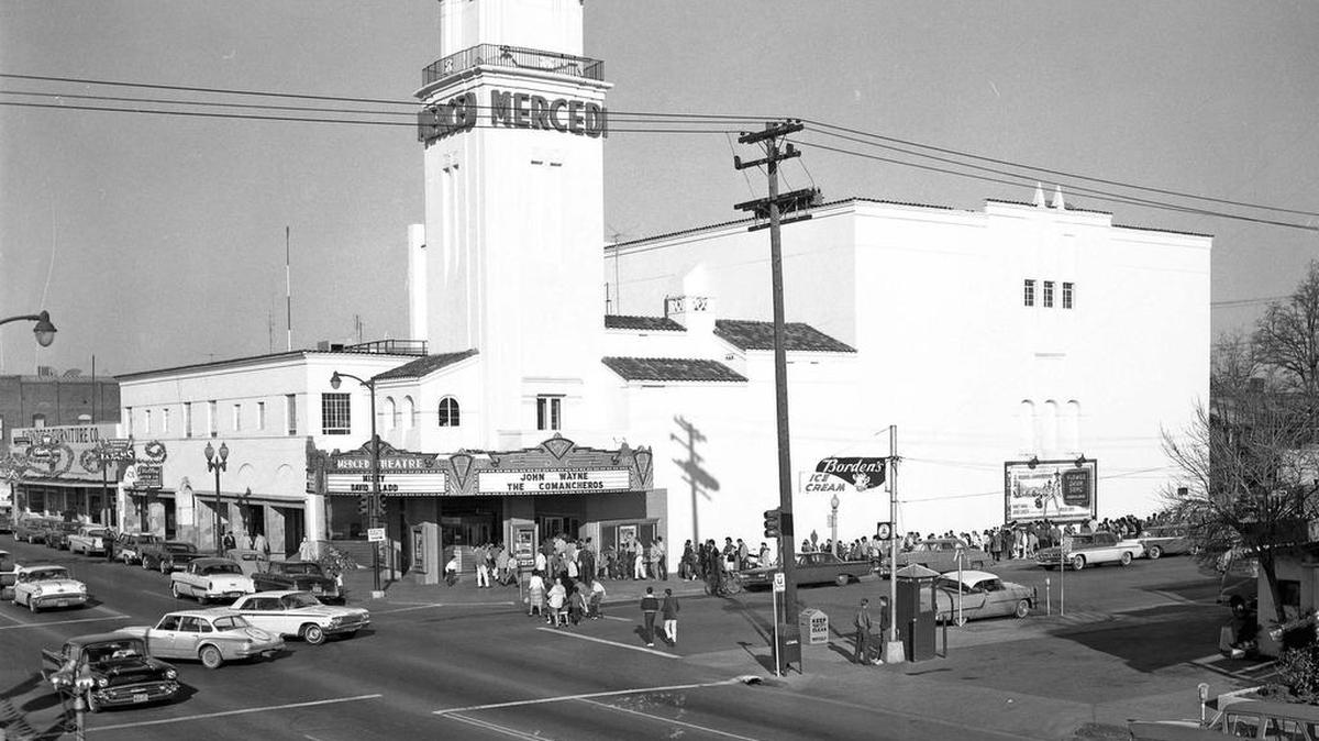 This 1961 picture featured in December shows cars from the 1940s to the 1960s by Merced Theatre, including Chevrolet Bel Air, Chevrolet Impala, Plymouth Valiant, Buick, Dodge, Chrysler, Ford, Mercury, Oldsmobile, and Pontiac.