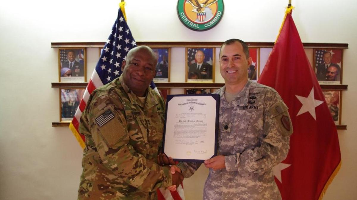 Maj. Gen. Charles Hooper, left, and Jeffrey Michael Burnett