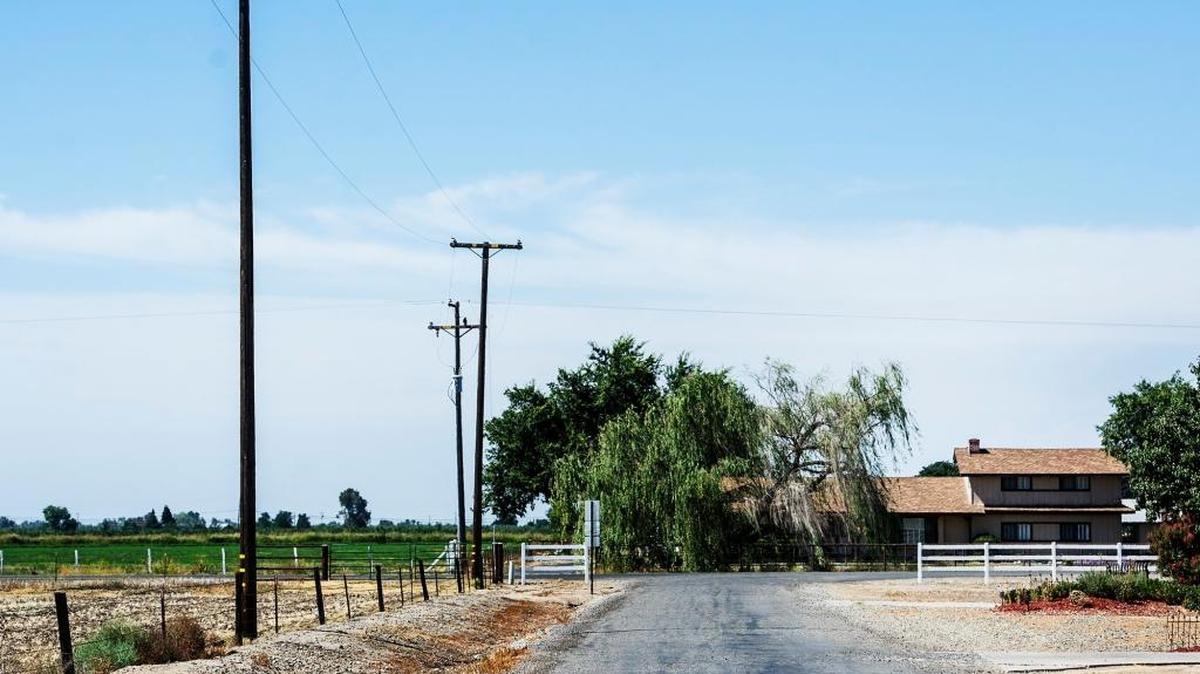 
Existing power lines that run along the property of Randy and Denise Bertuccio on Wardrobe Avenue in Merced on July 8. The Merced Irrigation District has proposed a plan to place new power lines with transmission poles reaching up to 95 feet in height, spanning 13.1 miles in south Merced. The Bertuccios and other residents are angered by the proposed placement of the new poles and power lines which will follow the same path as the existing poles.
