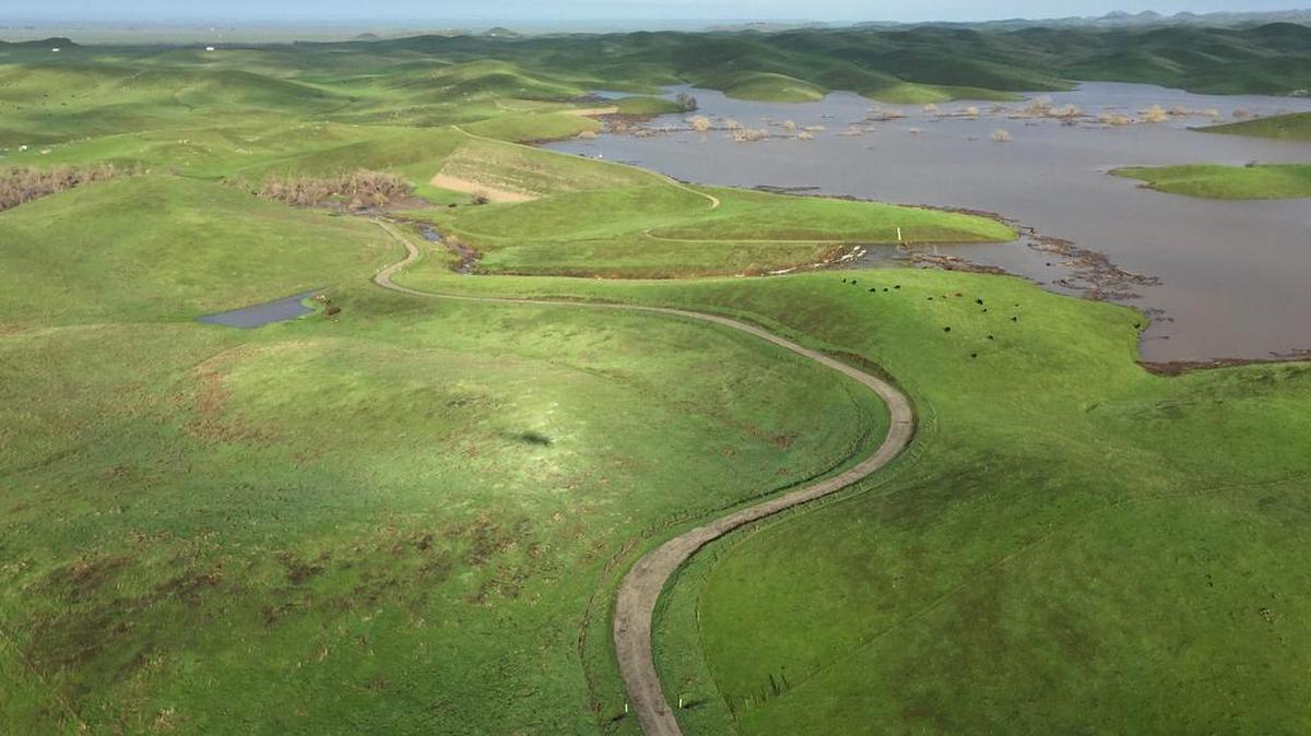 An aerial view of the Mariposa reservoir after a large volume of water resulted in water going over the dam’s spillway.