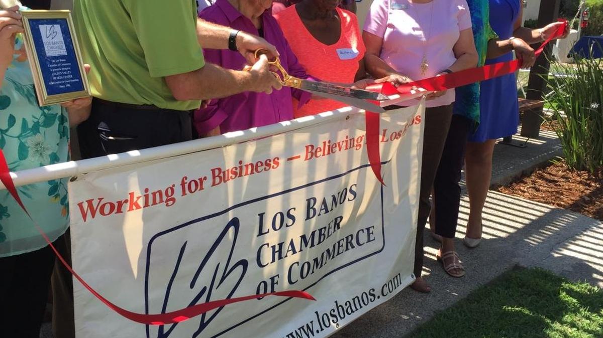Alicia L. Dicochea, center, gathers with Golden Valley Health Center supporters for a ceremonial ribbon-cutting in honor of the 40th year Golden Valley has been in Los Banos, on Friday, Aug. 12, 2016. Dicochea served on Golden Valley’s board of directors since 1971 and was also honored Friday for her years of service.
