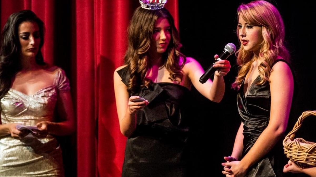 Mary Loera, 17, right, takes part in the onstage-question portion of the Miss Merced County, Miss Sierra Nevada and Miss Yosemite Valley Pageant on Saturday at Buhach Colony High School in Atwater.