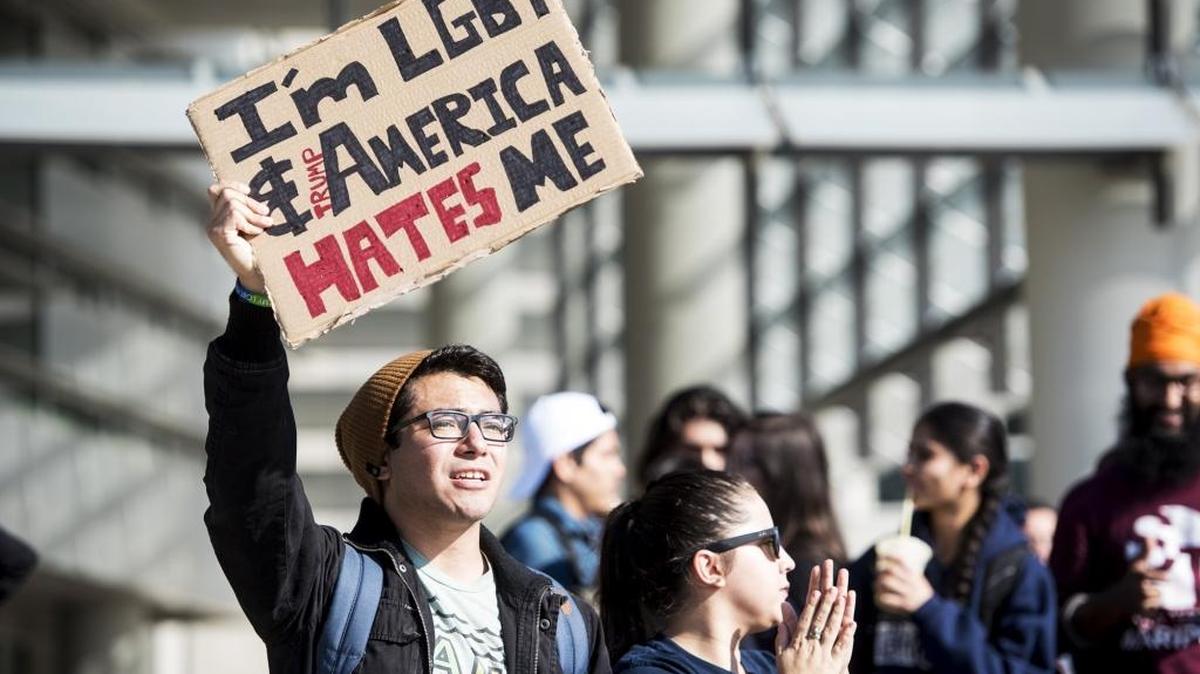 UC Merced student Juan Pirir, 21, of Englewood, left, and Roxy Soto, 22, of Lindsay, right, join fellow students as they protest President-elect Donald Trump on Nov. 9.