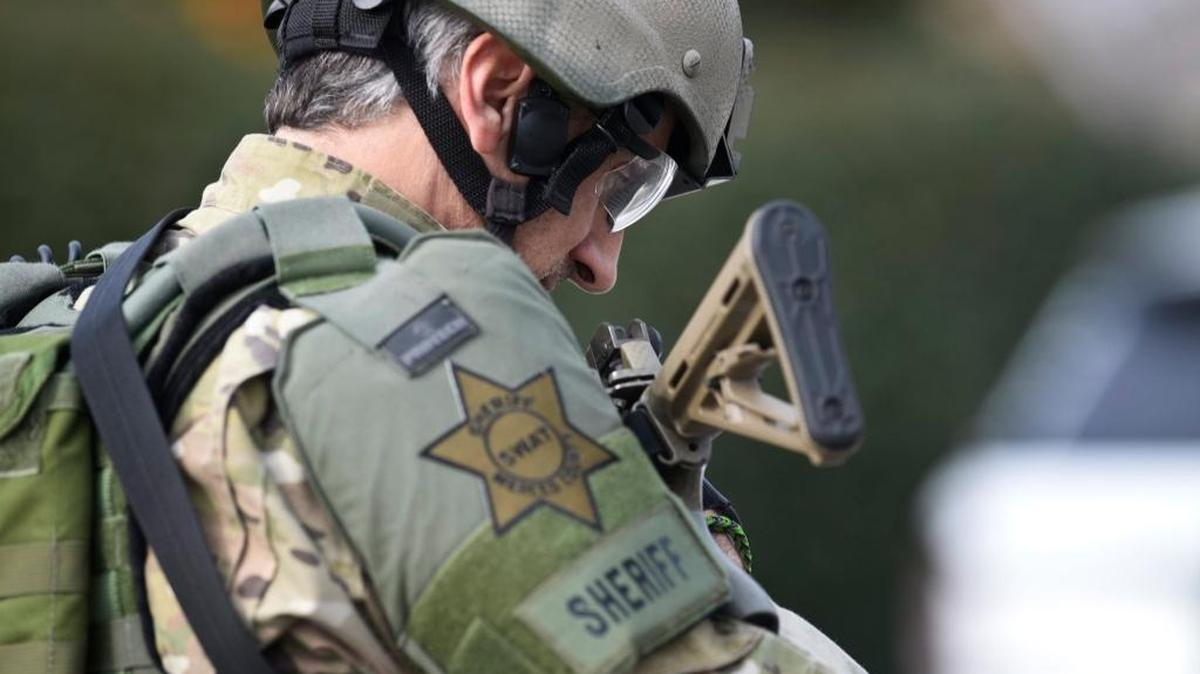 
A Merced County Sheriff’s Department SWAT team member leaves the scene after a standoff that lasted nearly three hours in January.
