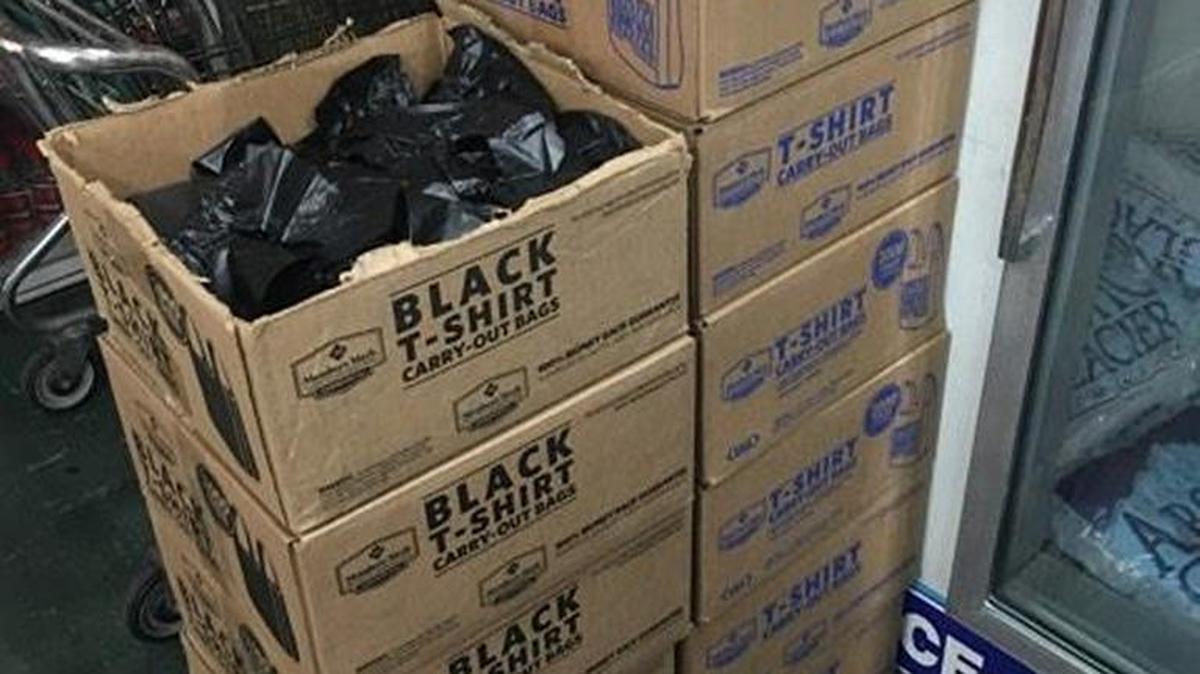 Boxes of plastic bags are stacked up in Save More Market at 2030 G St. in Merced on Friday. California voters passed Proposition 67, banning the use of plastic bags in grocery and other convenience stores.
