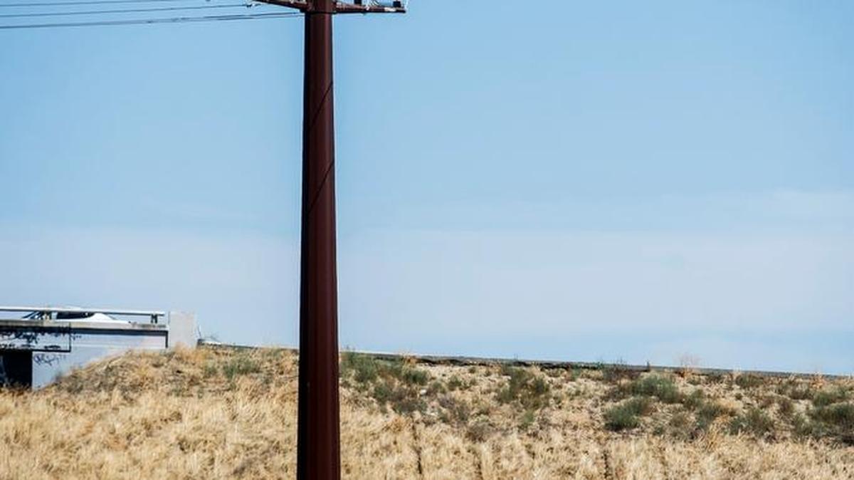 A power pole is seen near Highway 99 off Southern Pacific Avenue in Merced on Tuesday, July 7, 2015.