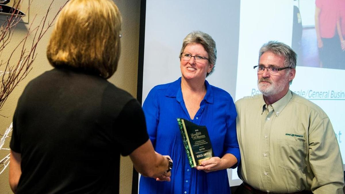Owners of Big O’Tires, Terry and Margaret Rossen, accept their Excellence in Business Retail/Wholesale/General Business Award during the 2016 Merced County Excellence in Business Awards ceremony Thursday at Hilmar Cheese Company Inc. in Hilmar.