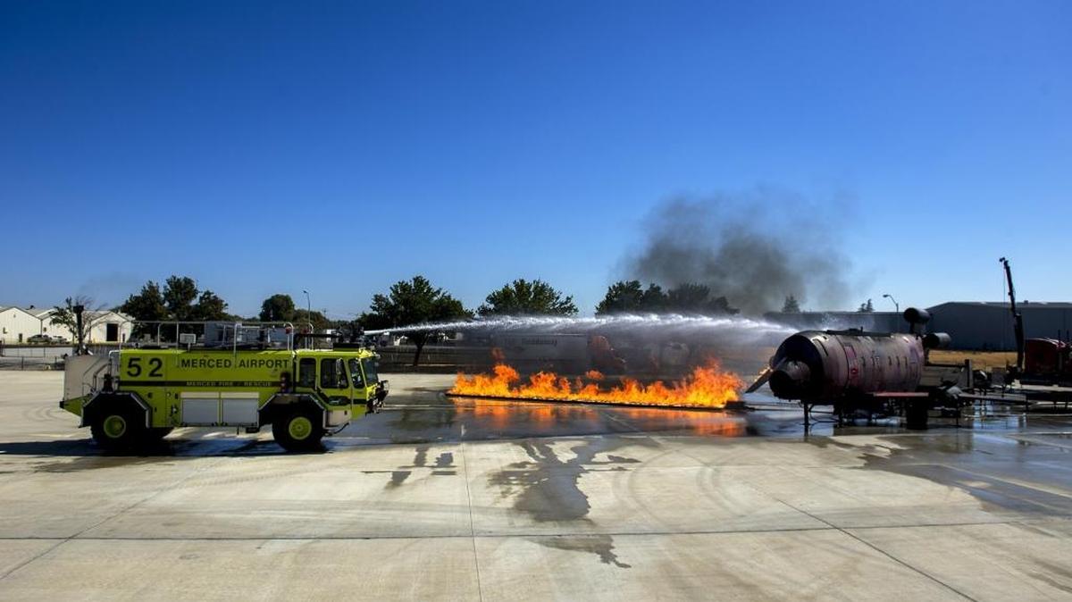 The Merced Fire Department trains on an Aircraft Fire Training Simulator at Merced Regional Airport in Merced, Calif., on Wednesday, Oct. 5, 2016.