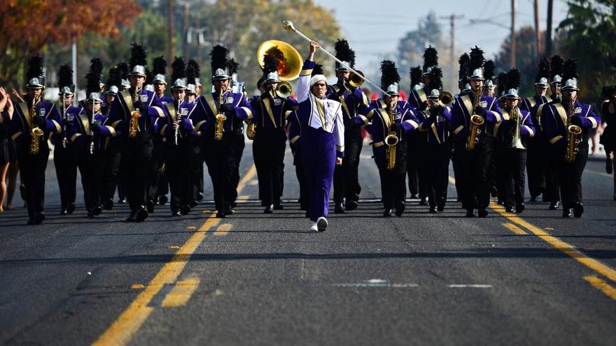 Livingston High School drum major Vitor Vieira leads the marching band along East Childs Avenue during the 55th annual Central California Band Review at Golden Valley High School in Merced in November 2014.