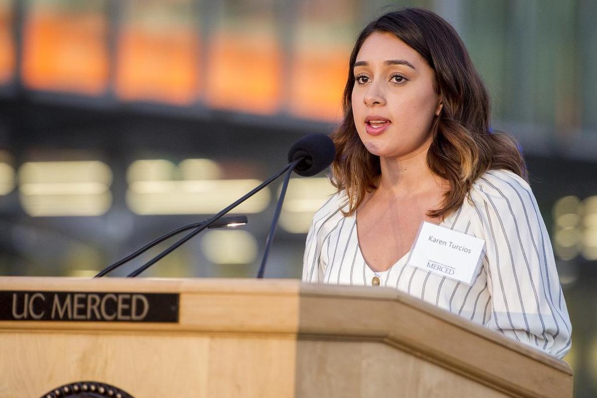 Karen Turcios, a former University of California, Merced student and a project manager for the university’s new dining hall, The Pavilion, speaks during a building lighting ceremony to celebrate the opening of the first three buildings of the Merced 2020 Project, on the UC Merced campus in Merced, Calif., on Thursday, Aug. 16, 2018.
