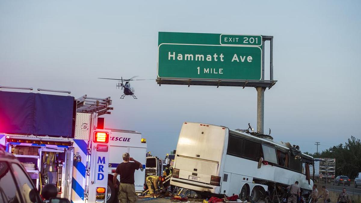 Rescue crews respond to a charter bus crash on northbound Highway 99 between Atwater and Livingston on Aug. 2, 2016. The image by Sun-Star photographer Andrew Kuhn won honorable mention for news photography by a daily newspaper with a circulation of less than 50,000.