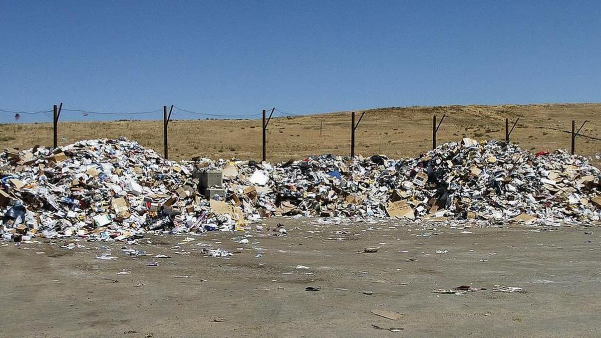 Garbage awaits recycling and sorting near the entrance of the Merced County landfill.