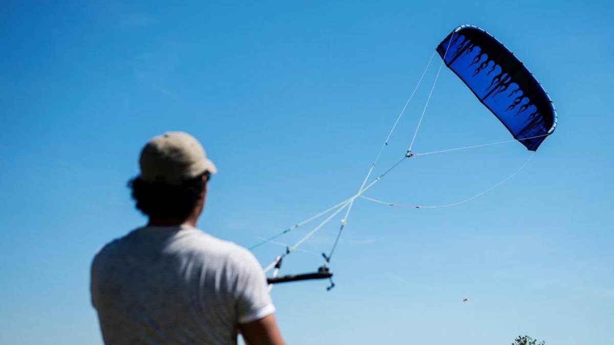 Sergio Gomez, 29, of Turlock flies a large kite during the fifth annual Livingston Kite Festival, presented by the Knights of Columbus, at Livingston Middle School in Livingston on Saturday, April 2, 2016.