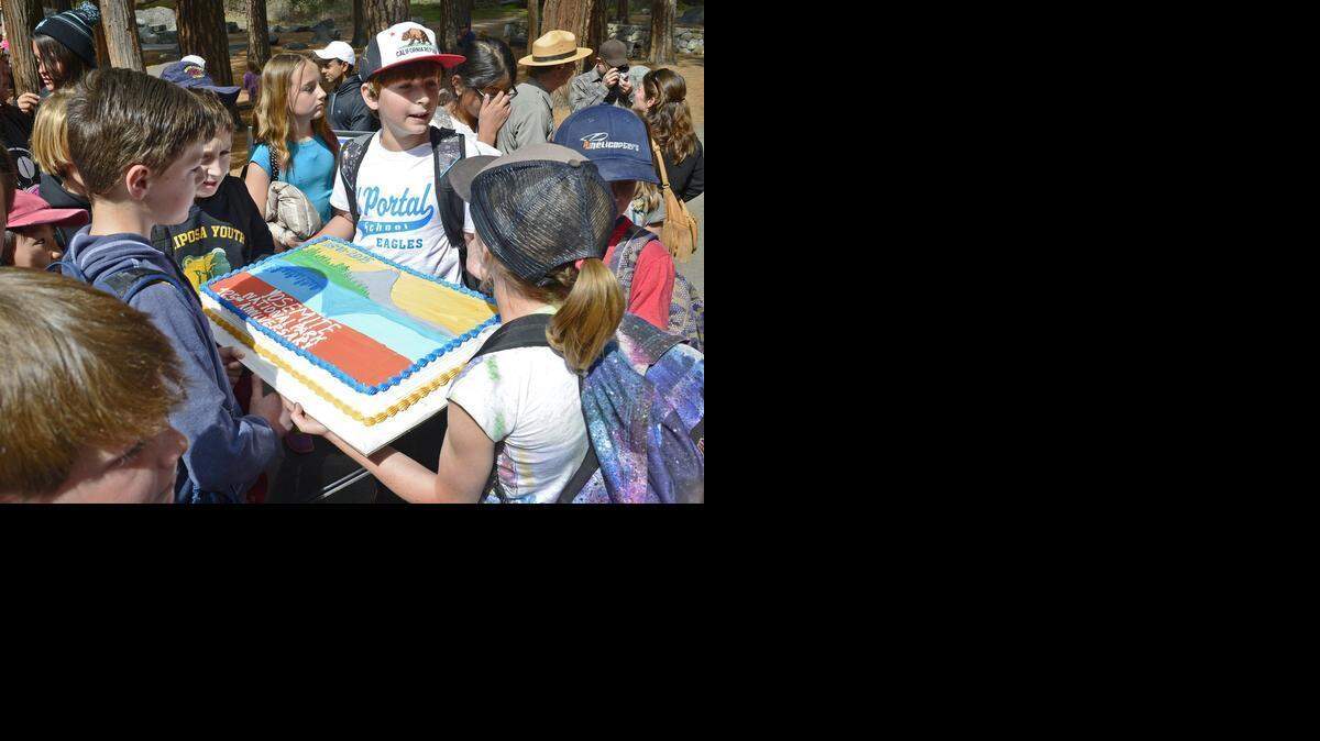 
Youngsters hold an anniversary cake at Yosemite National Park’s 125th anniversary celebration, held at the Yosemite Falls viewing area Tuesday.
