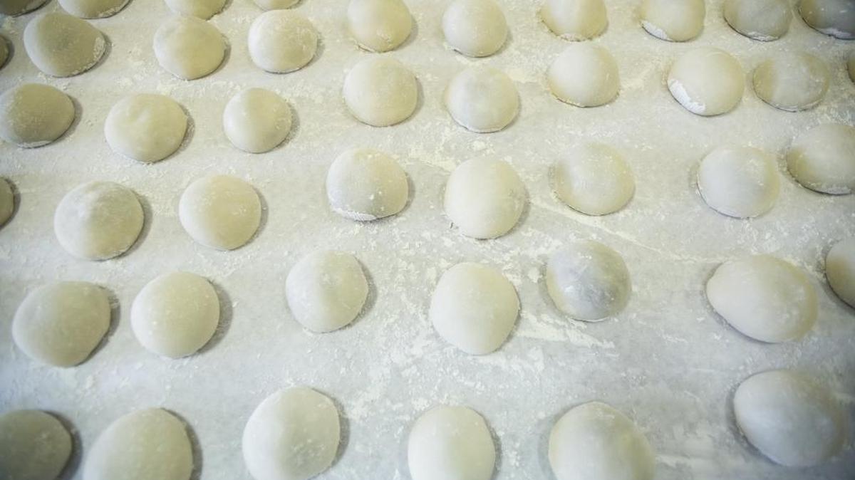 Finished mochi rests on a table during the annual Mochitsuki at Livingston United Methodist Church in Livingston on Friday. Mochi is a rice cake that is made before New Year’s celebrations. The sweet rice is soaked before it is steamed, ground, pounded and formed into rice cakes.