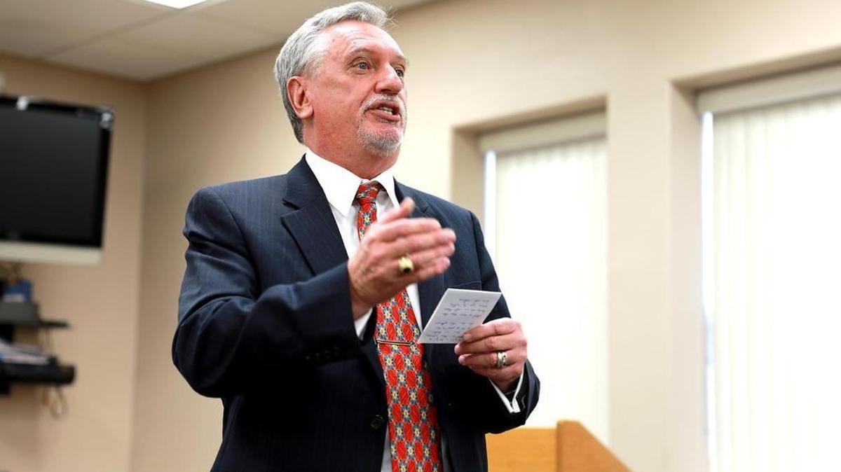 Steve Tietjen talks to the audience of family, MCOE employees and other guests following the oath of office ceremony at the Merced County Office of Education on Monday, Dec. 12, 2016.