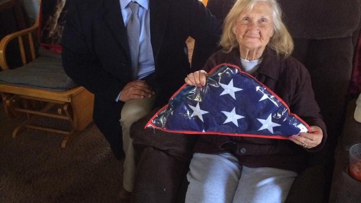 Merced police Detective Joe Perez returned a U.S. memorial flag to Mary Spratley, the widow of World War II Sgt. Melvin L. Spratley, at her home in Turlock on Wednesday.