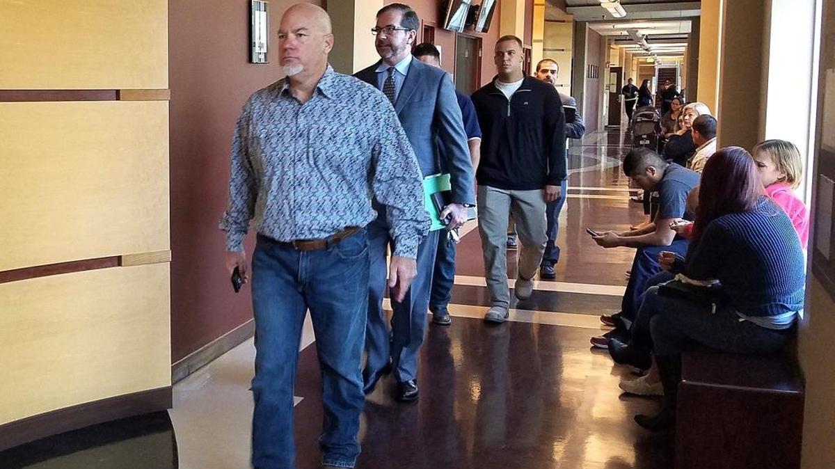 Merced-area contractor Greg Opinski, followed by his attorney Jeff Hammerschmidt, walks to the courtroom for his and co-defendant Tommy Jones’ arraignment Wednesday in Merced Superior Court.