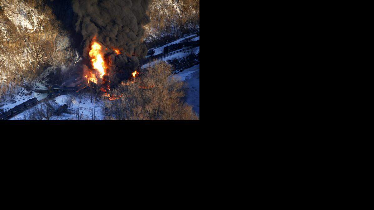 
Smoke and flames erupt from the scene of a train derailment March 5 near Galena, Ill. A BNSF Railway freight train loaded with crude oil derailed in a rural area where the Galena River meets the Mississippi.

