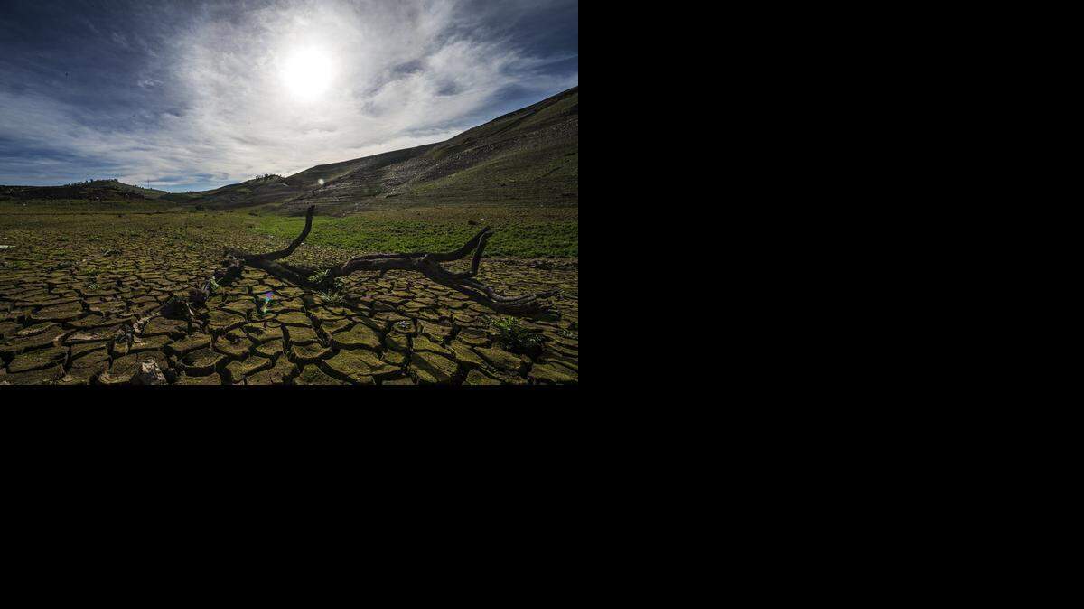 
In early March, farmers were told Lake McClure was at 8 percent of capacity and they would not receive any water for irrigation. A section of dry lake bed appears above. 
