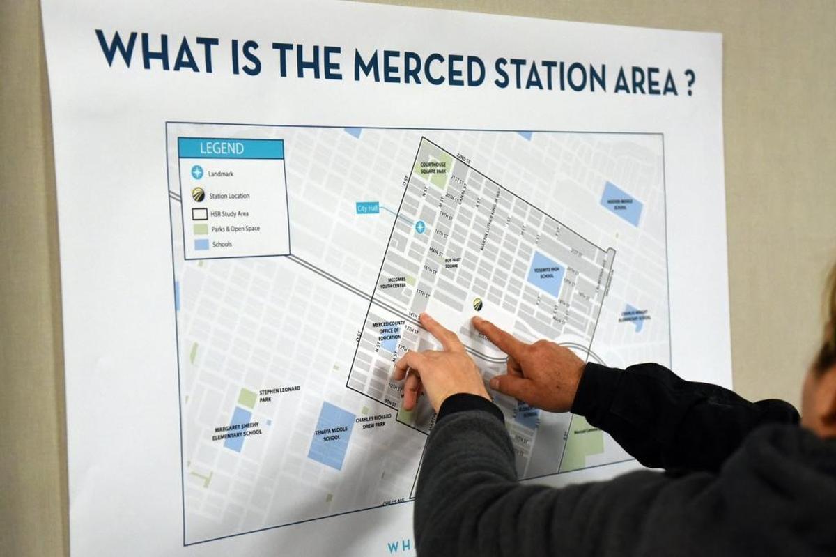 A couple of Merced residents take s closer look at a map of the proposed high-speed rail stop in Merced during a rail workshop at City Hall on Wednesday, Feb. 24, 2016. Many residents expressed an interest in balancing Merced's small-town feel with a more metropolitan city.