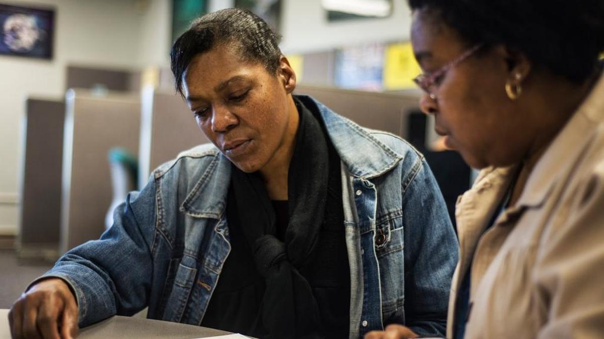 Cynthia Camp, 53, of Merced, left, looks over paperwork with Employment Training Specialist Cheryl Lewis at the Merced County Department of Workforce Investment in Merced, Calif., on Wednesday, Feb. 25, 2015. Merced County’s unemployment rate fell in April 2016 compared with last year, with manufacturing jobs leading the way for growth, labor market analysts reported Friday.