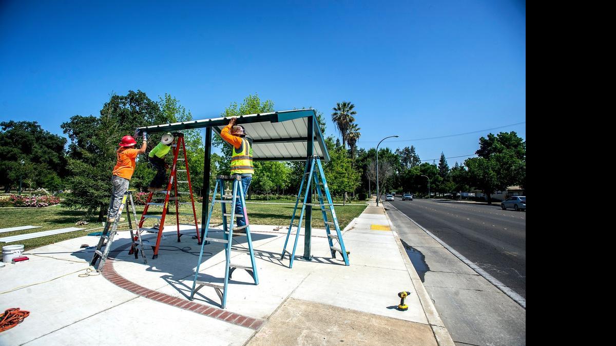 
Workers attach roofing during construction of a bike shelter at the corner of M Street and West 26th Street in Merced in May. Merced County’s unemployment rate dipped in June to 10.5 percent, a drop of four-tenths of a percentage point since May, according to the latest numbers from the Employment Development Department.
