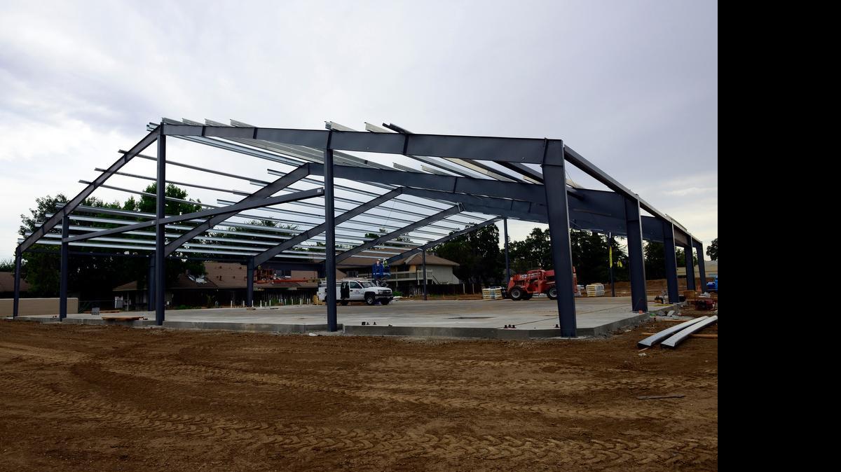 
A crew works Thursday on a 12,000-square-foot office building going up in the 2000 block of Park Avenue in Merced.
