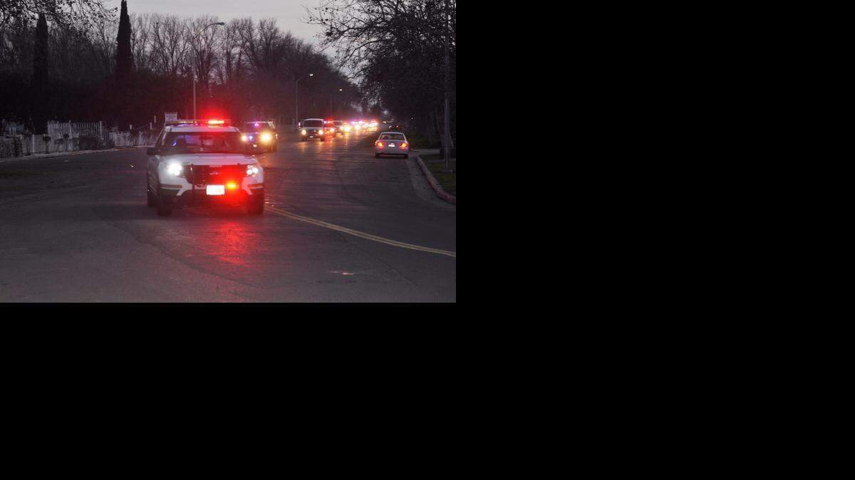 
A procession of Merced County sheriff’s vehicles brings the body of Deputy Lukas Hukill to Stratford Evans Funeral Home. 
