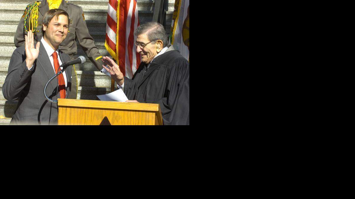 
Marc Garcia is sworn in Nov. 30, 2007, by Superior Court Judge Roberte Falasco as a judge in Merced County. 
