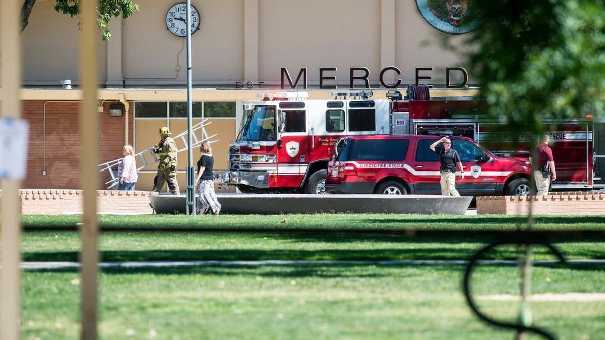 Fire crews secure the scene after smoke coming from the kitchen of a culinary class caused a campus evacuation at Merced High School on Tuesday, May 17, 2016.