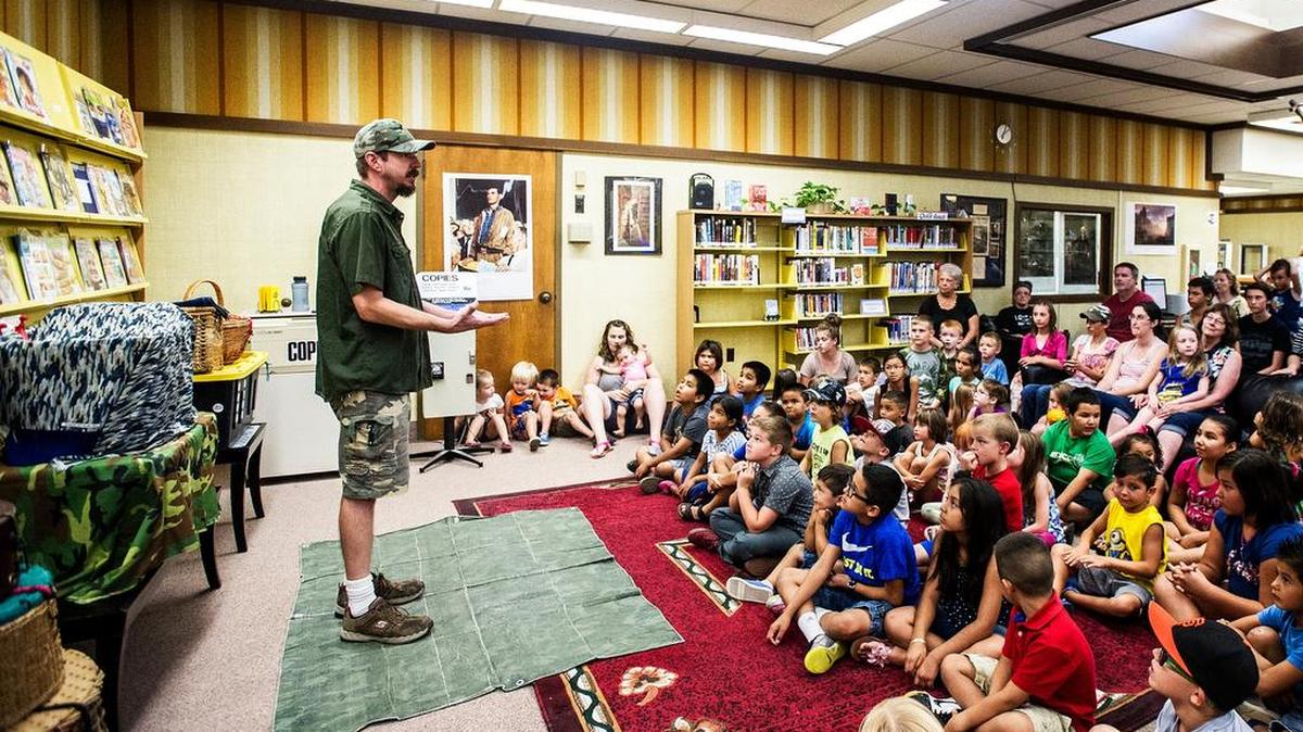 
Eric Johnson of E&M’s Reptile Family puts on a live reptile show at the Atwater branch of the Merced County Library in Atwater on Wednesday.
