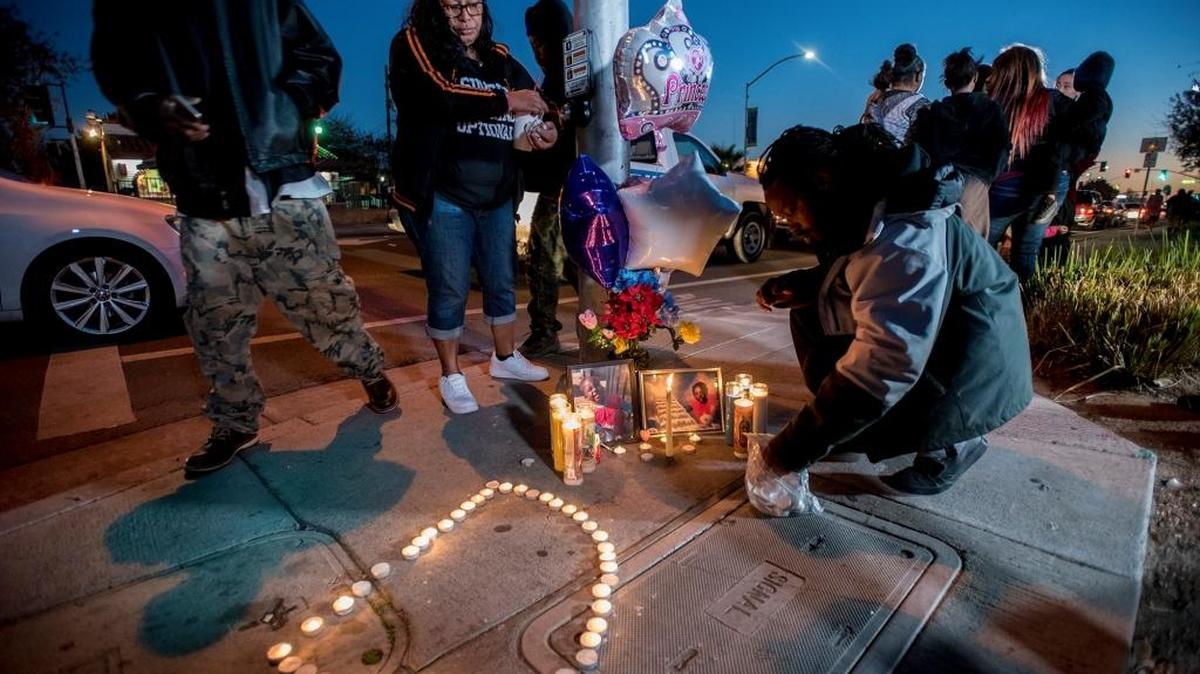 Candles are placed in the shape of a "D" during a candlelight vigil for 3-year-old Merced resident, Dayveonna Polk, near the intersection of R Street and 18th Street in Merced, Calif., on Tuesday, Dec. 5, 2017. Polk died at Valley Children's Hospital on Tuesday, after suffering major injuries when she was struck by a hit-and-run driver in Merced on Monday, Dec. 4, 2017.