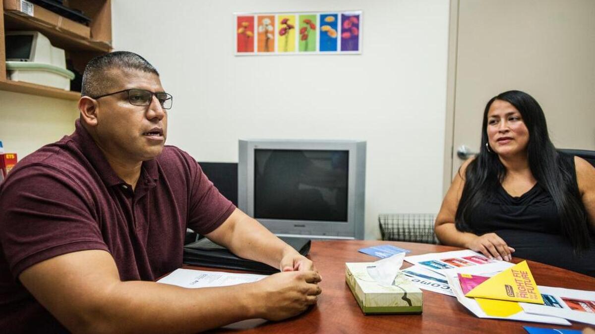 
Pedro Elias, public affairs director at Planned Parenthood Mar Monte in Fresno, speaks about services provided for men, women and teens with Regional Program Manager Desirre Herrera at Planned Parenthood Mar Monte in Merced on Tuesday. . 
