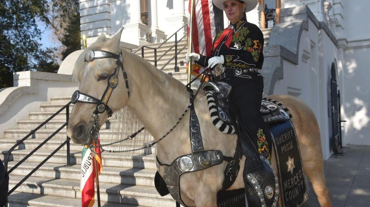 Member of the Merced County Sheriff’s Posse, Laurette Locke, on her horse, Rosie, during a press conference in front of the Courthouse Museum on Thursday. The Sheriff’s Posse was chosen to represent the state and county in the presidential inauguration on Jan. 20.