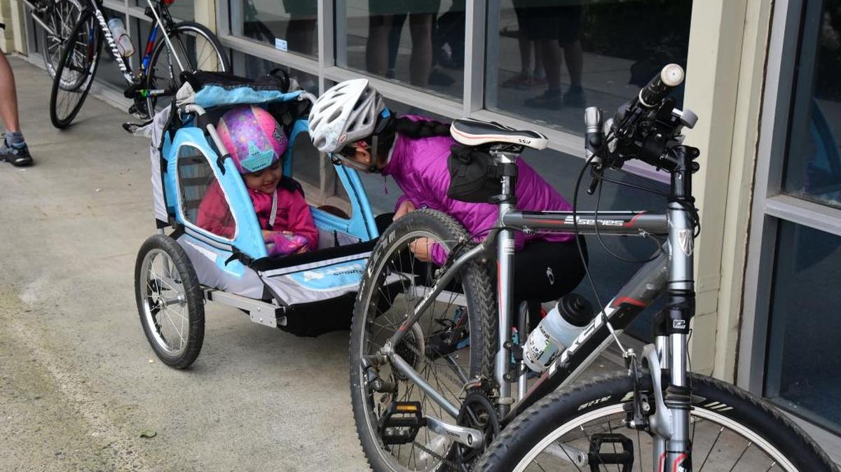 Megan Ortiz-Millan, 32, getting her and her niece read in front Kevin’s Bikes on Olive Avenue for the Merced Road Ride, one of the Merced Bicycle Coalition's traditions during the month of May for National Bike Month.
