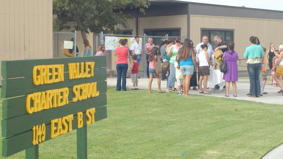 A reception for parents is held at Green Valley Charter School as it first opened for classes in August 2012.