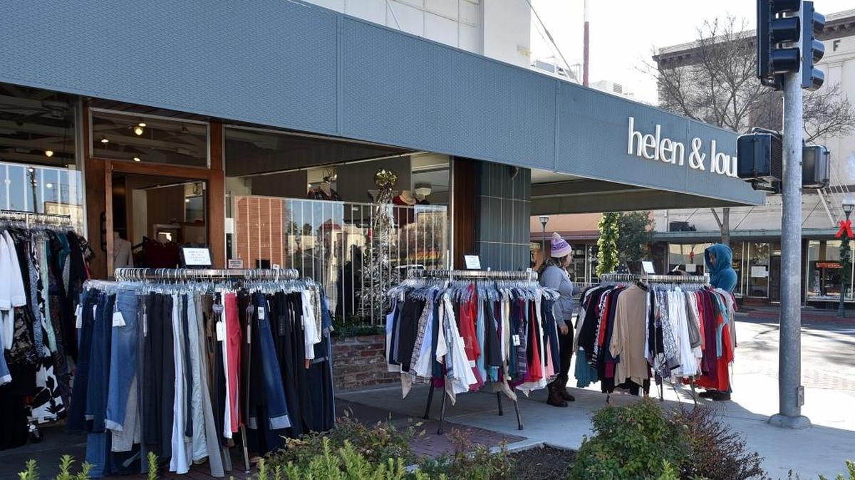 Shoppers browse merchandise at Helen & Louise, a women’s clothing boutique on Canal Street in downtown Merced, during the store’s biggest sale of the year on Monday, Dec. 26, 2016.